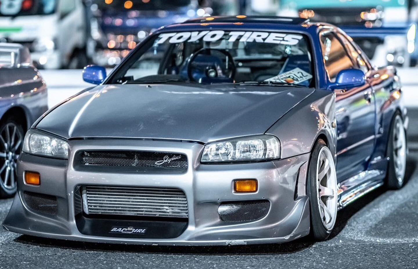 R34 and RX-7 under highway lights
