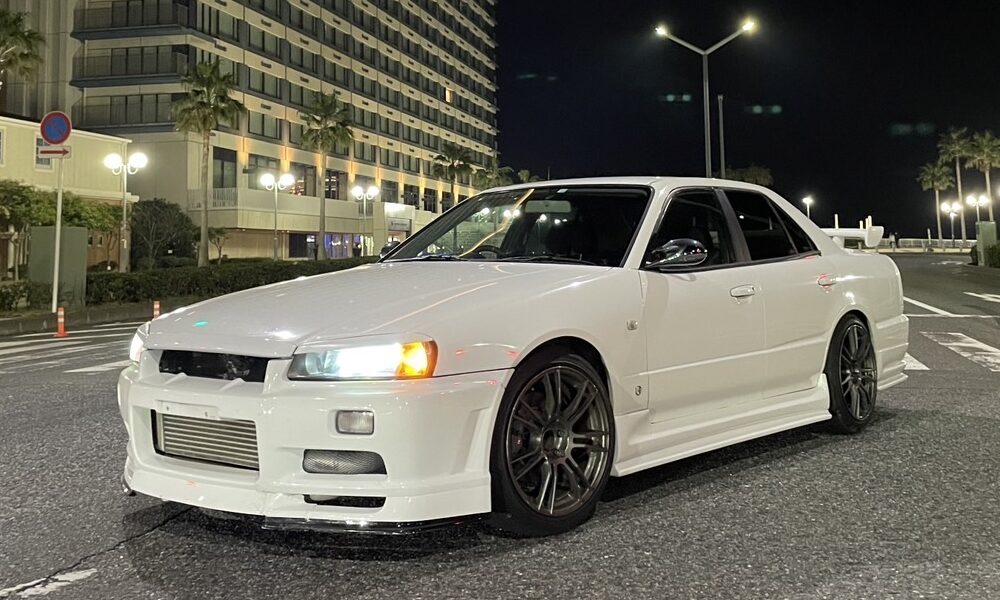 Nissan Skyline ER34 4-door sedan at night