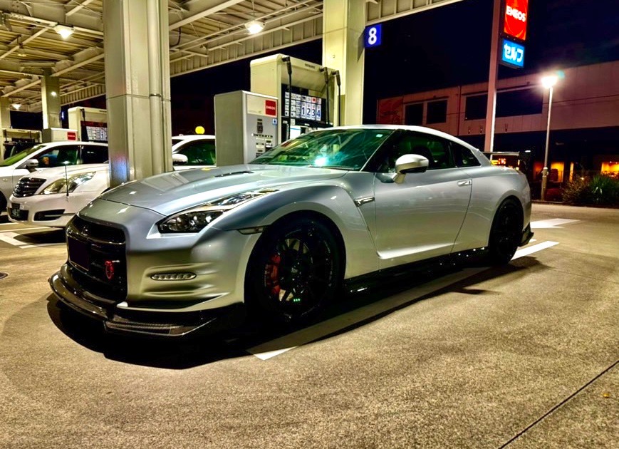 Skyline GT-R parked at Umihotaru PA Tokyo under neon lights