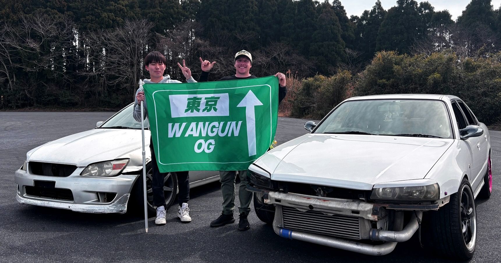 Drift car sliding sideways on Minami Chiba Circuit during a Wangun OG drift lesson
