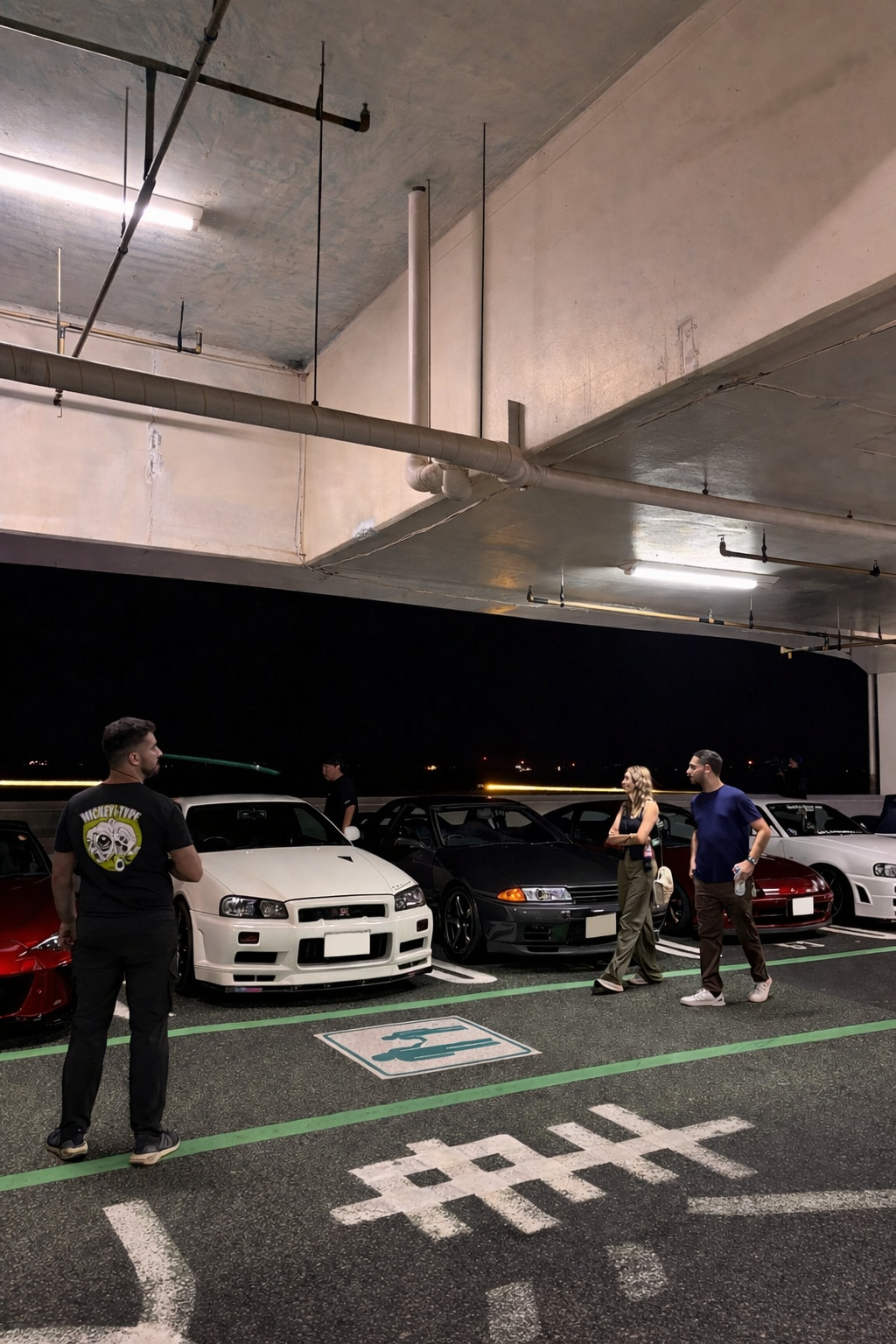 Classic and modern JDM cars lined up at Umihotaru PA