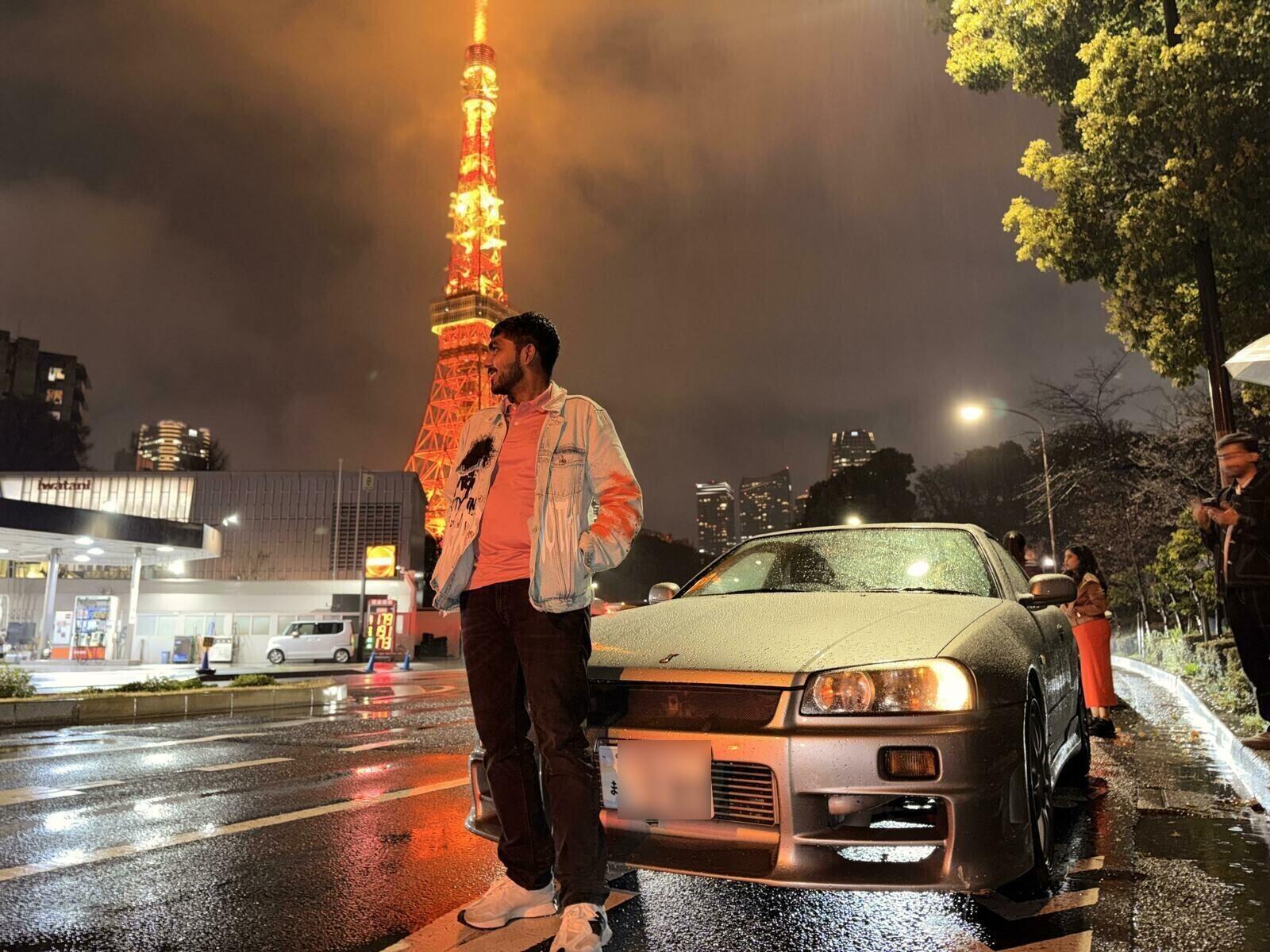 Guests with Tokyo Tower and car at night