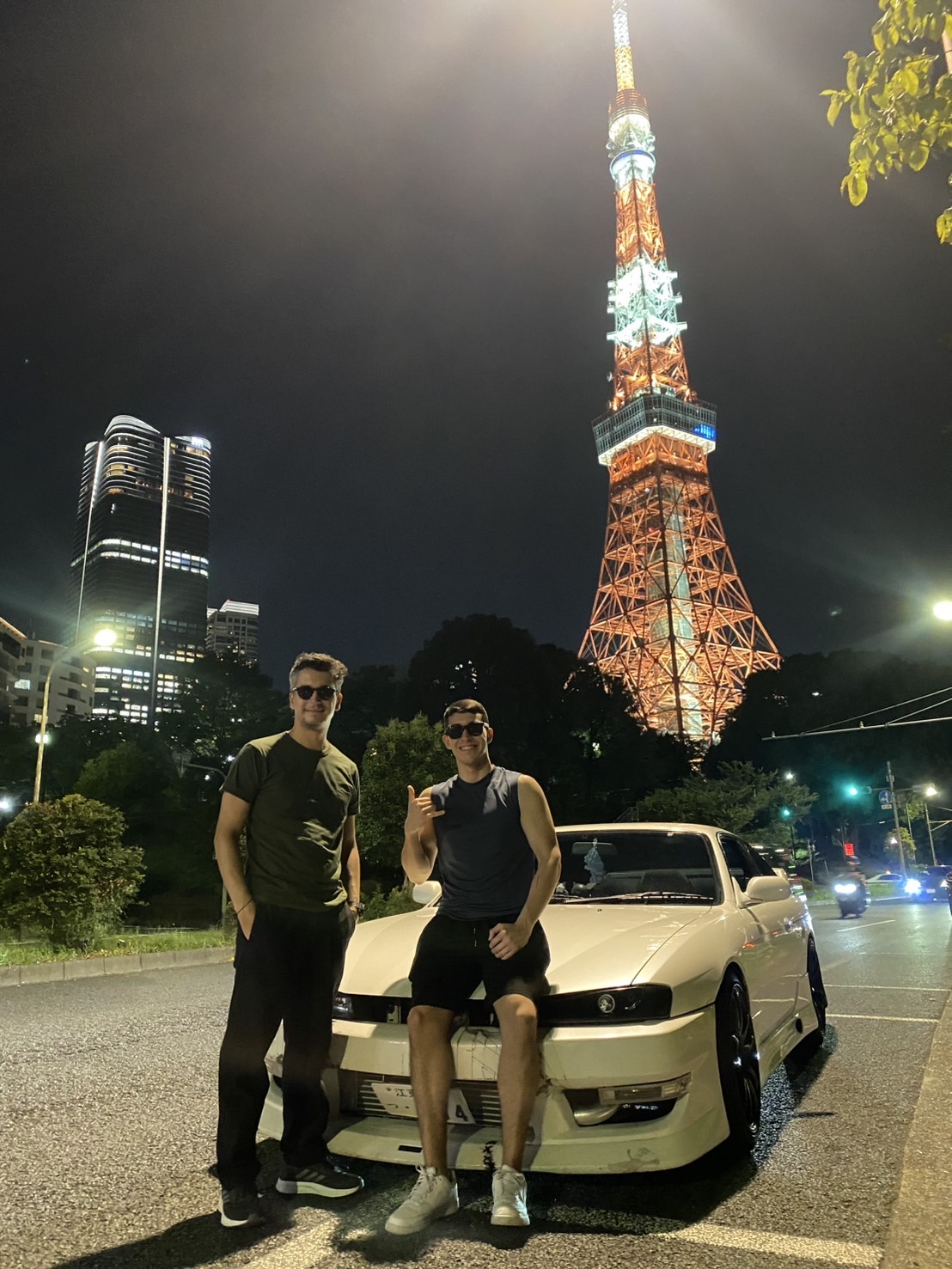 Guests taking photos with Tokyo Tower at night