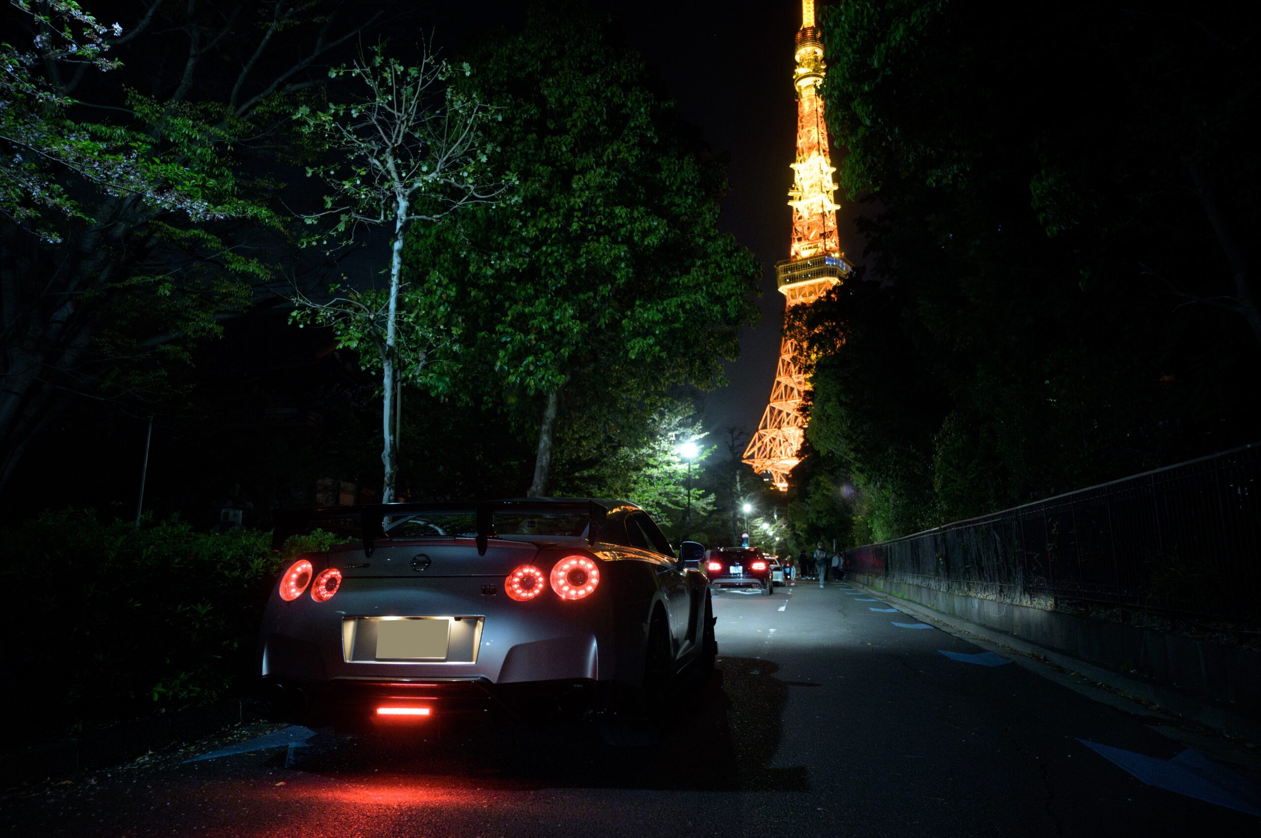 Guests with Tokyo Tower during a Tokyo night drive