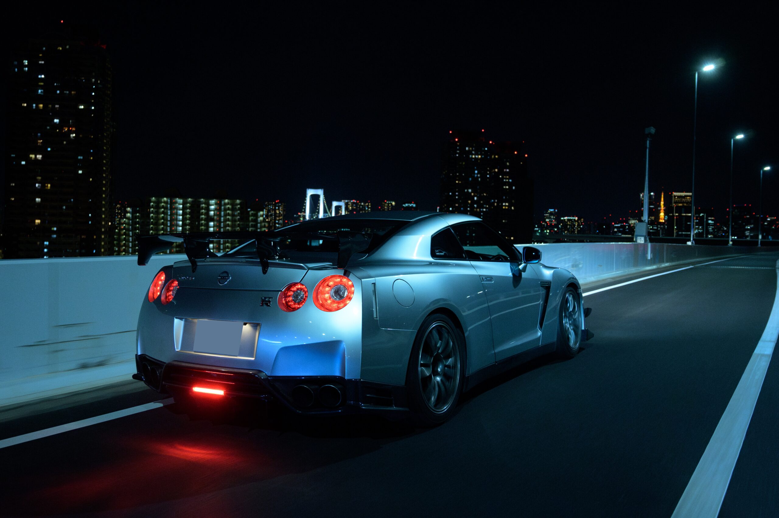 Nissan GT-R R35 profile on the streets of Tokyo under night lights